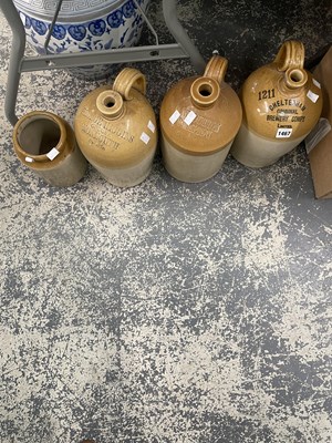 Lot 1467 - Three two tone stoneware flasks and a jar