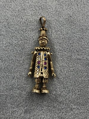 Lot 254 - A 9ct hallmarked gold clown pendant with a...