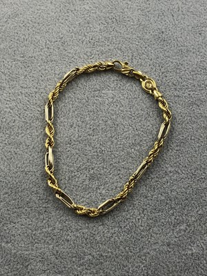 Lot 256 - A 750-stamped Italian bracelet with a rope and...