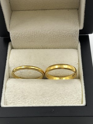 Lot 261 - Two 22ct hallmarked gold wedding rings. Sizes...