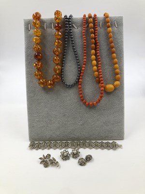 Lot 290 - Untested beads to include two rows of amber...