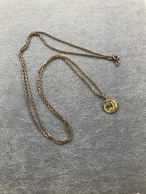 Lot 307 - A Zodiac pendant stamped 333 suspended on a...
