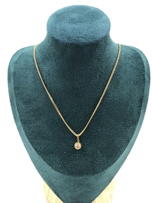 Lot 312 - A 9ct hallmarked gold curb chain suspending an...