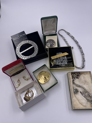 Lot 321 - A Ladycrow Scotland pewter scarf ring, a...