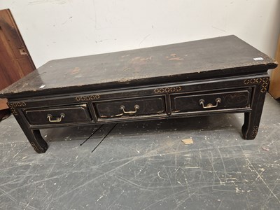 Lot 503 - An eastern lacquer decorated low table with...
