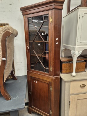 Lot 515 - A mahogany floor standing two part corner...