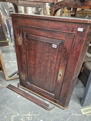 Lot 520 - A Georgian oak corner cabinet.
