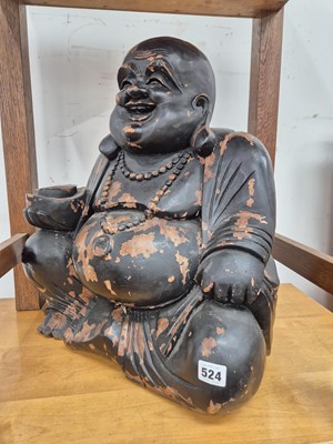 Lot 524 - A large carved eastern buddha figure.