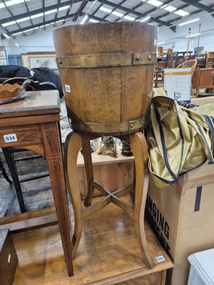 Lot 533 - A Lister coopered oak planter on shaped stand.
