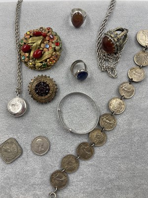 Lot 325 - An antique gilded mourning brooch with a...