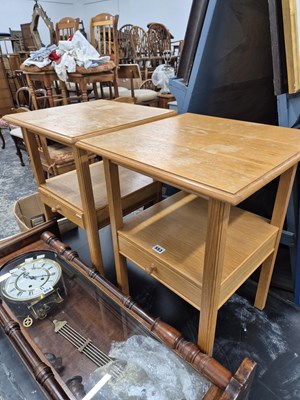 Lot 553 - A pair of oak bedside tables. H 62 W 45 D 44cms