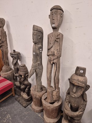 Lot 566 - An indonesian carved tall standing figure of a...
