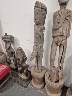 Lot 567 - An indonesian carved tall standing figure of a...
