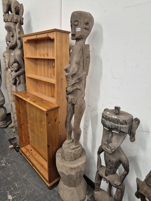 Lot 570 - An indonesian carved tall standing figure...