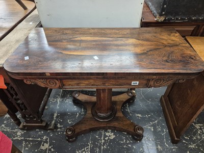 Lot 585 - A William IV rosewood foldover tea table on...