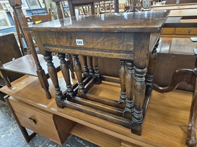 Lot 589 - A good quality nest of oak occasional tables...