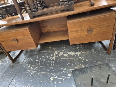 Lot 590 - A retro teak dressing table.