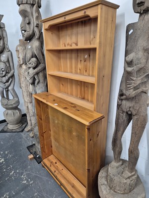 Lot 592 - A pine open front small bookcase and a tall...