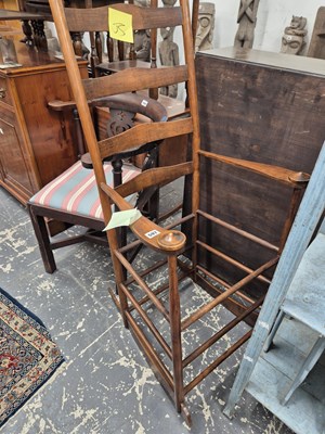 Lot 597 - An arts and crafts rocking chair.