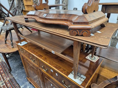 Lot 599 - A retro teak coffee table.