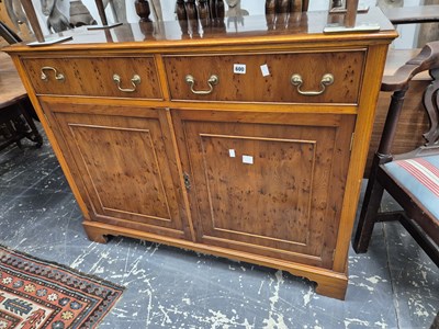 Lot 600 - A yew wood side cabinet.