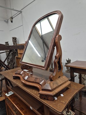 Lot 601 - A Victorian flame mahogany swing dressing...