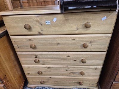 Lot 634 - A modern pine chest of drawers.