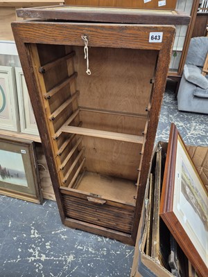Lot 643 - A tambour front file cabinet.