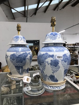 Lot 1511 - A pair of blue and white covered jar table...