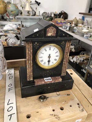 Lot 1526 - A mantel timepiece within a black slate case...