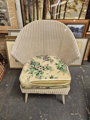 Lot 666 - A Lloyd loom armchair.