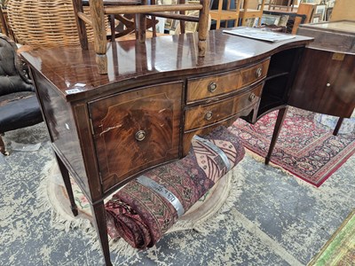 Lot 675 - A late Georgian style mahogany sideboard.