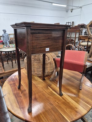 Lot 677 - A small sewing table and a rocking stool.