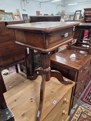 Lot 700 - A tripod based occasional table.
