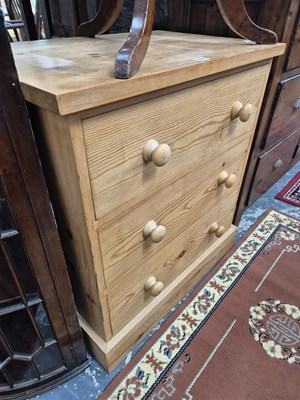Lot 701 - A small pine chest of three drawers