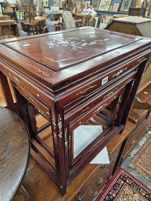 Lot 704 - An oriental hardwood and inlaid nest of three...