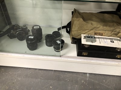 Lot 1558 - An Olympus OM4 camera, various lenses, a...