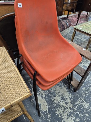 Lot 709 - A set of three mid century stacking chairs.