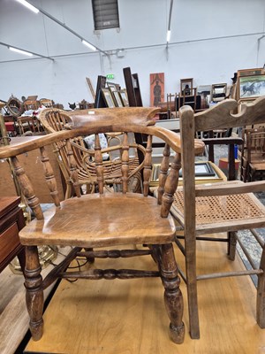 Lot 713 - An antique smokers bow armchair, an oak...