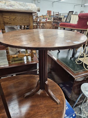Lot 760 - An antique oak topped tripod table.