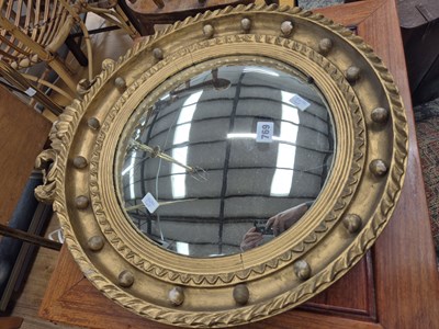 Lot 769 - A convex wall mirror.Diameter 49 Height 58 cm