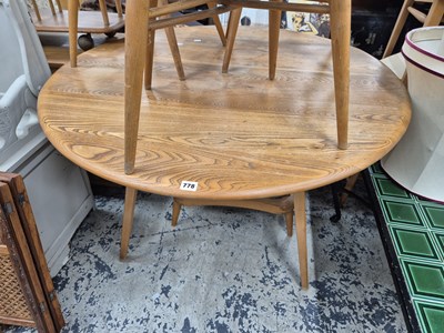 Lot 778 - An Ercol pale elm dining table and an Ercol...