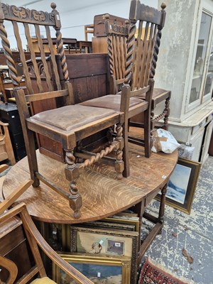 Lot 783 - An oak gateleg dining table and three oak side...