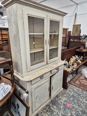 Lot 785 - A rustic pine kitchen cabinet with glazed...