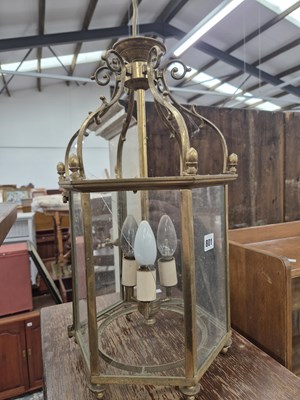 Lot 801 - An octagonal hall lantern. 27 x 50cms