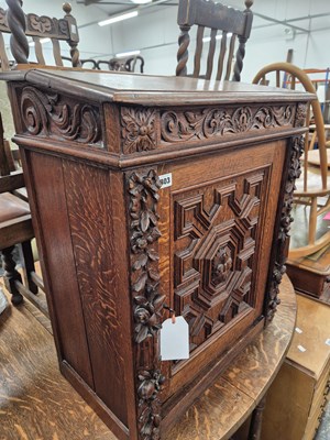 Lot 803 - A 19th century carved oak cabinet with writing...