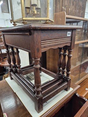 Lot 800 - An oak nest of tables and an occasional table.