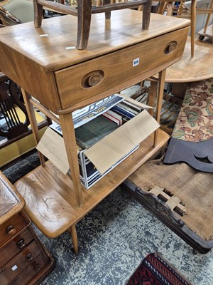 Lot 808 - An Ercol single drawer side table and an Ercol...