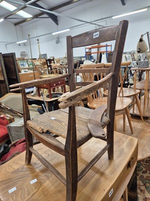 Lot 809 - A rustic childs chair.