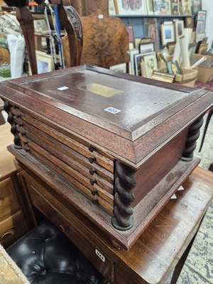 Lot 823 - A coin collectors cabinet.